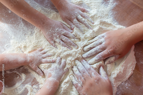 Child s hands playing with the flour