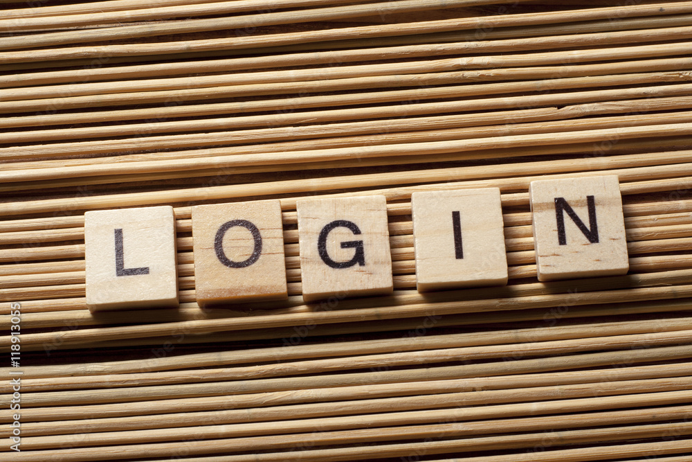Obraz premium LOGIN word written on wood block at wooden background