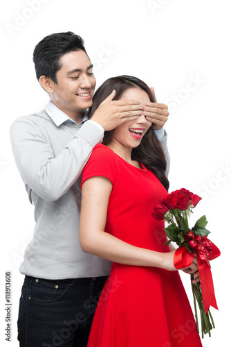 Asian man makes present to his lovely sweetheart. Young man givi