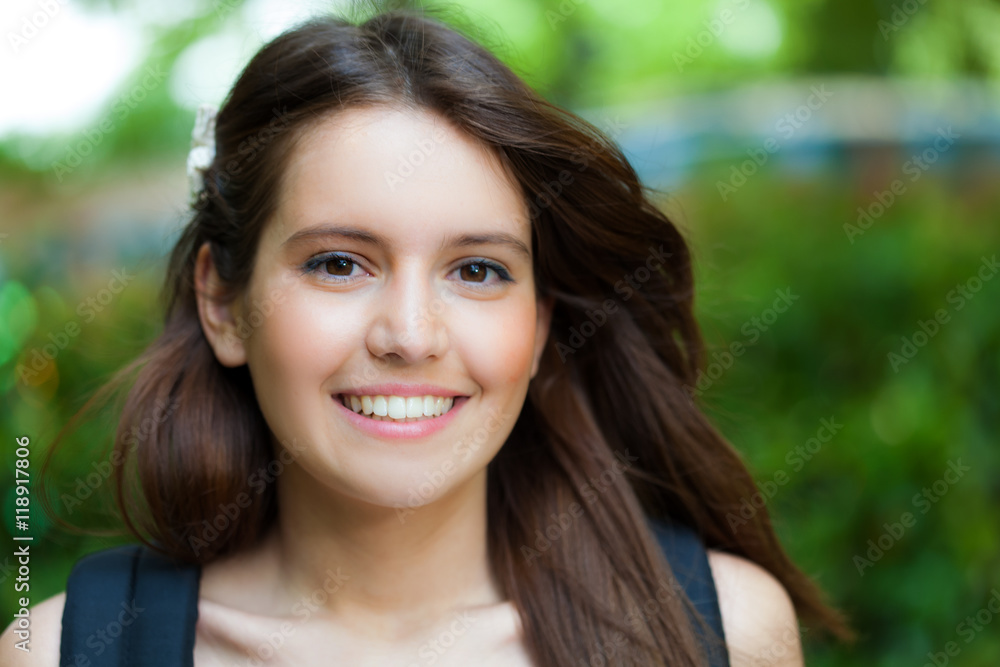 Beautiful young woman portrait in a green park
Beautiful young woman portrait in a green park