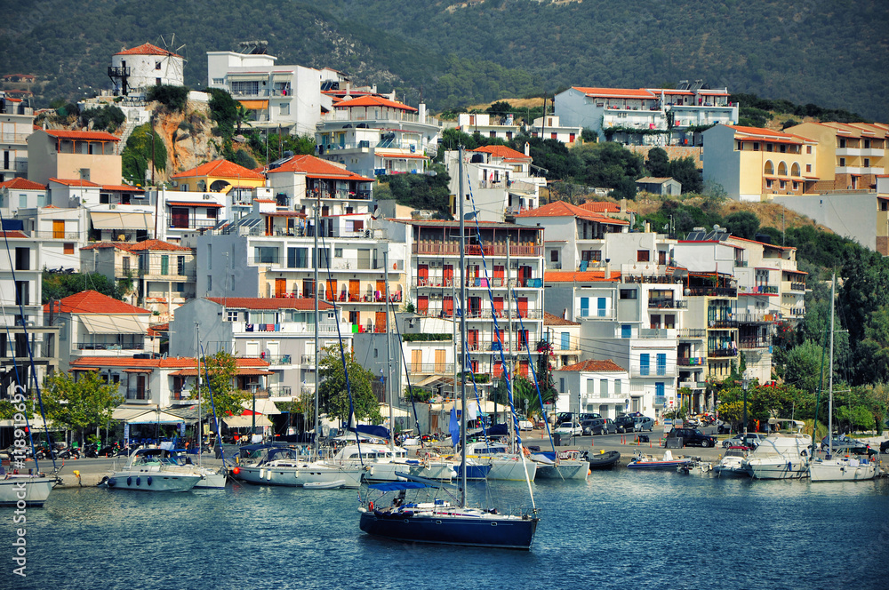 Pictorial islands of small Greek islands-Skiathos with typical houses and boats.