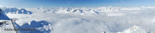 Winter mountains panoramic view with clouds in the valley. Corvatsch, Engadin, Switzerland. photo