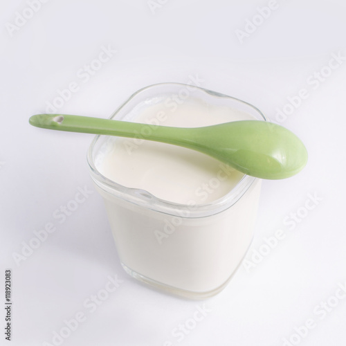 Yogurt in a glass cup, isolated on a white background