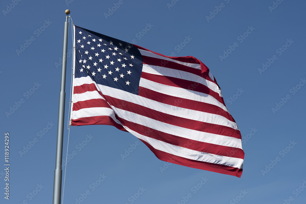 Photo of American flag waving in the wind