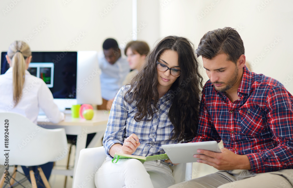business couple working together on project at modern startup office business couple working together on project at modern startup office