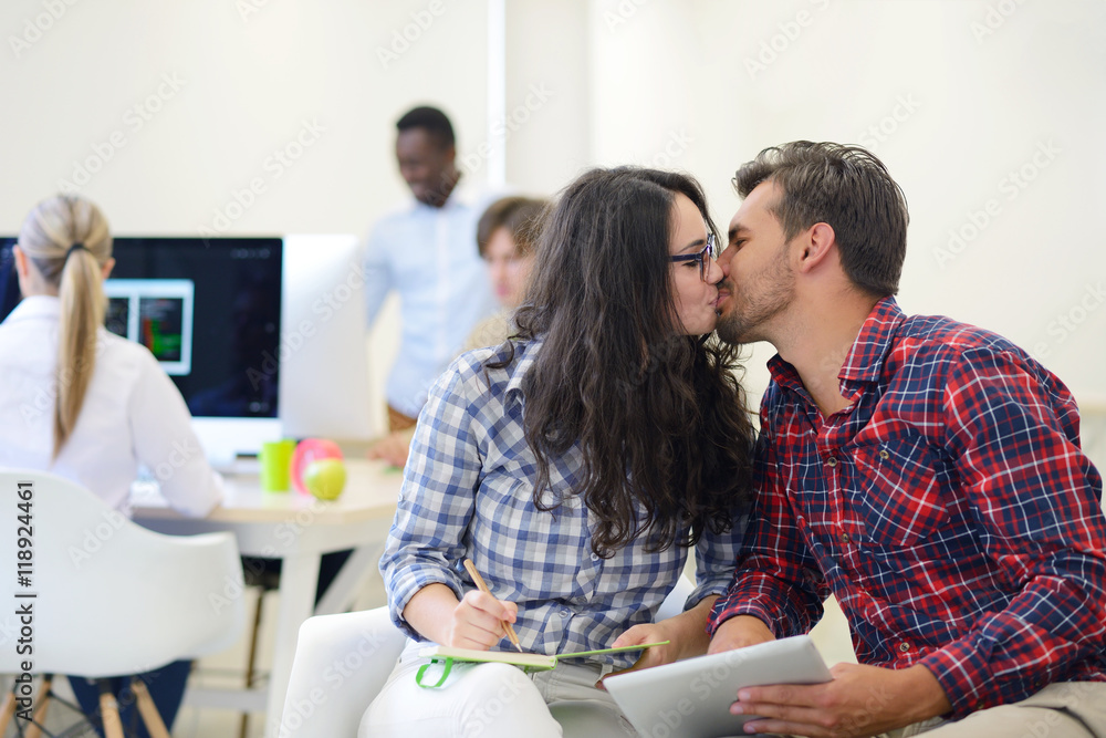 business couple working together on project at modern startup office business couple working together on project at modern startup office