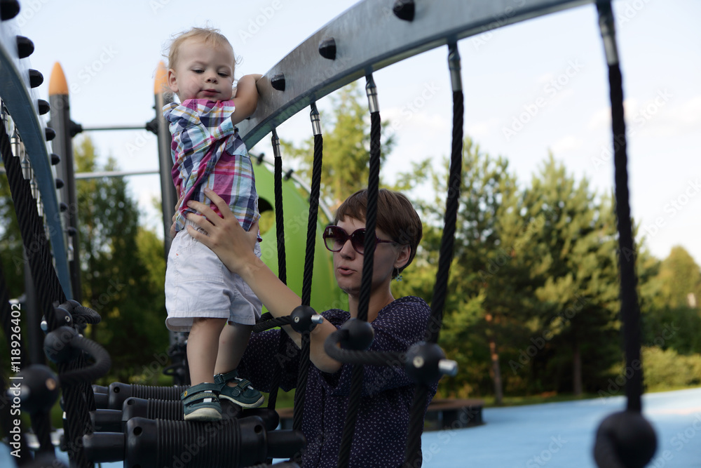 Obraz premium Mother with son at playground