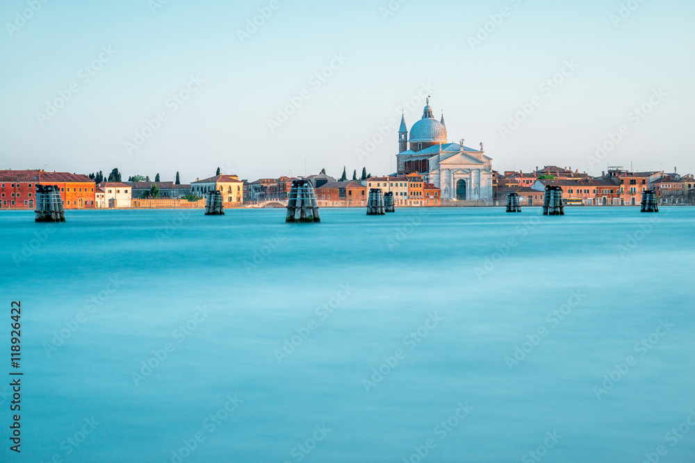 Sunset view on La Giudecca island with basilica del Redentore on the sunset in Venice. General plan with copy space