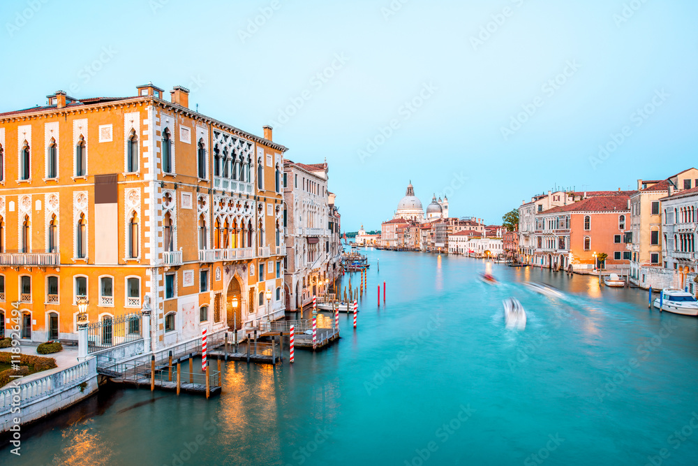 View on illuminated Grand canal with Santa Maria basilica from Accademic bridge at the dusk in Venice. Long exposure image technic