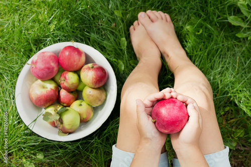 Hand with red apple