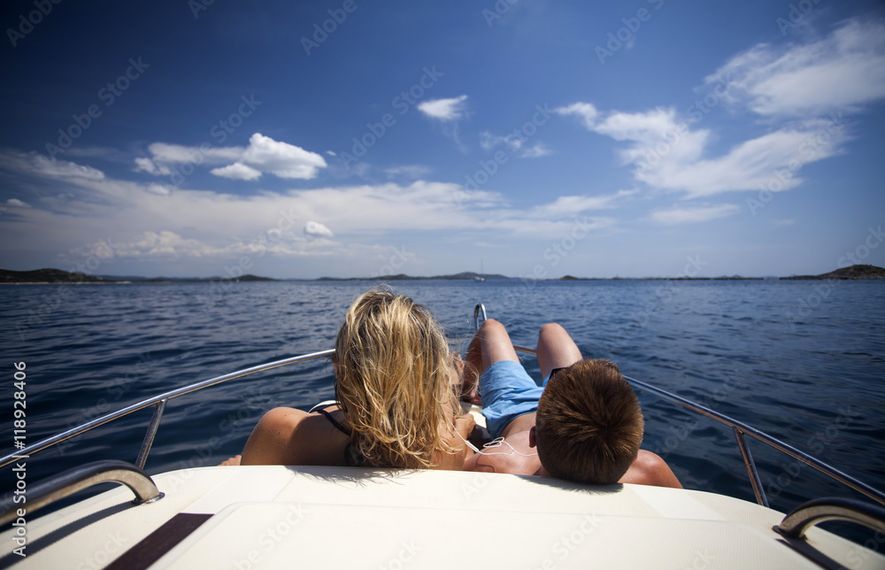 Fototapeta premium Man and woman on a sailing boat