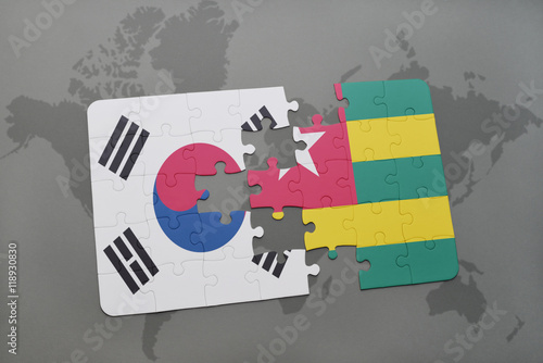 puzzle with the national flag of south korea and togo on a world map background.