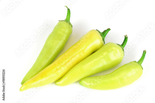 fresh farm picked yellow and green peppers isolated on white background