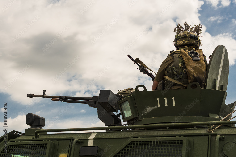 Gunner prepares to shoot a machine gun NSVT 12.7