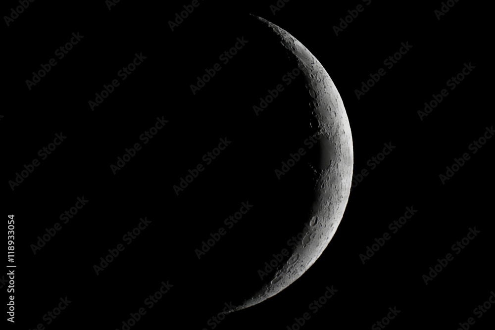 Obraz premium Moon waxing crescent. Young Moon. Crescent moon on black sky. Waxing Crescent.