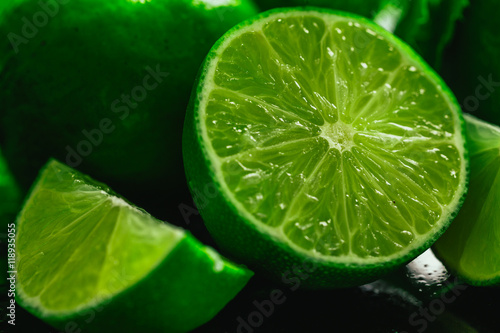 Fresh green mint and lime close-up on a dark background © ruslan1117