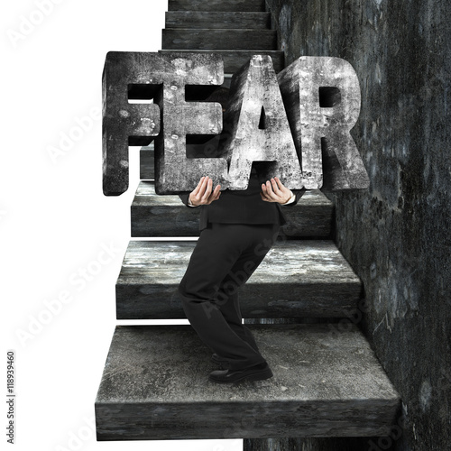 Photography Businessman carrying fear concrete word on old concrete stairs