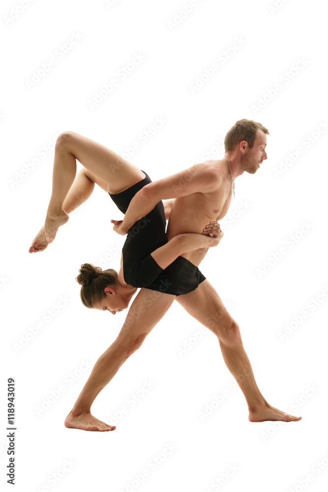 Paired gymnastics. Man and girl perform support