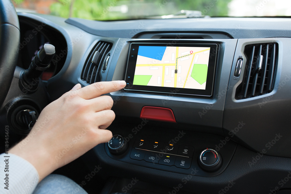 Man touching to screen multimedia system with navigation map