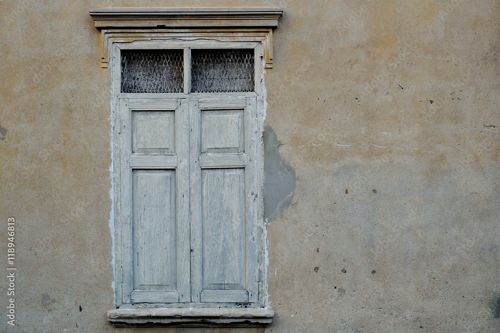 Fototapeta premium Vintage white color wood windows on the old walls.