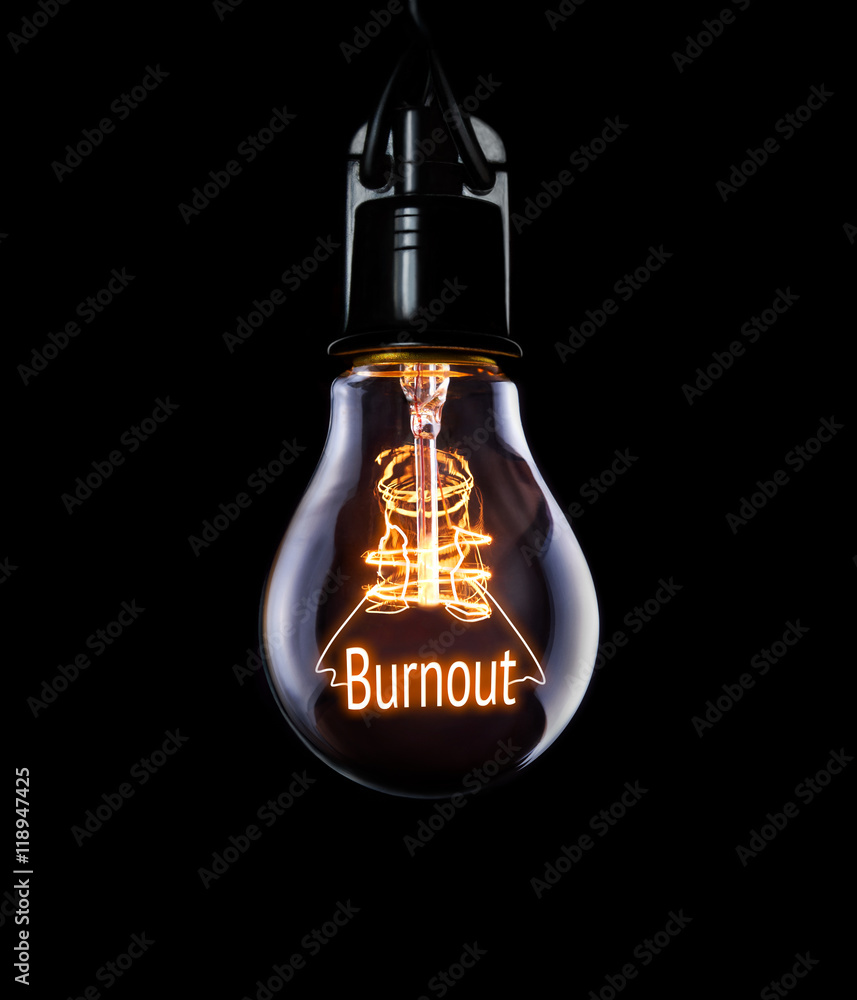 Hanging lightbulb with glowing Burnout concept.