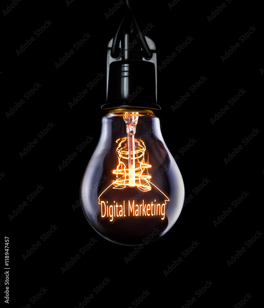 Hanging lightbulb with glowing Digital Marketing concept.