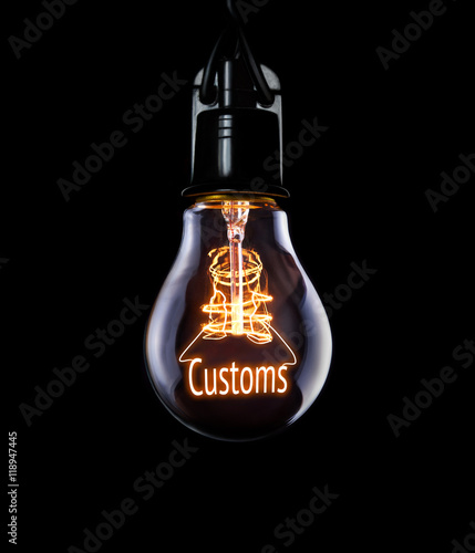 Obraz na płótnie Hanging lightbulb with glowing Customs concept. w salonie