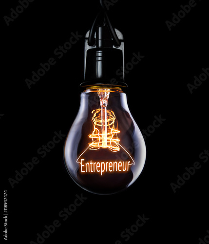 Hanging lightbulb with glowing Entrepreneur concept.
