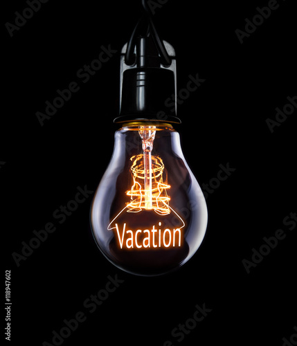 Hanging lightbulb with glowing Vacation concept.