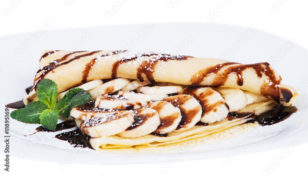 Pancakes stuffed bananas and chocolate on a plate Pancakes stuffed bananas and chocolate on a plate