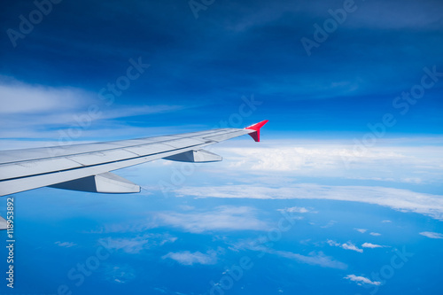 View airplane cloudy in blue sky