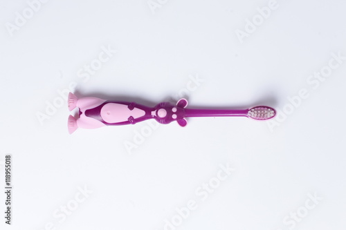 One purple baby toothbrush isolated over white background