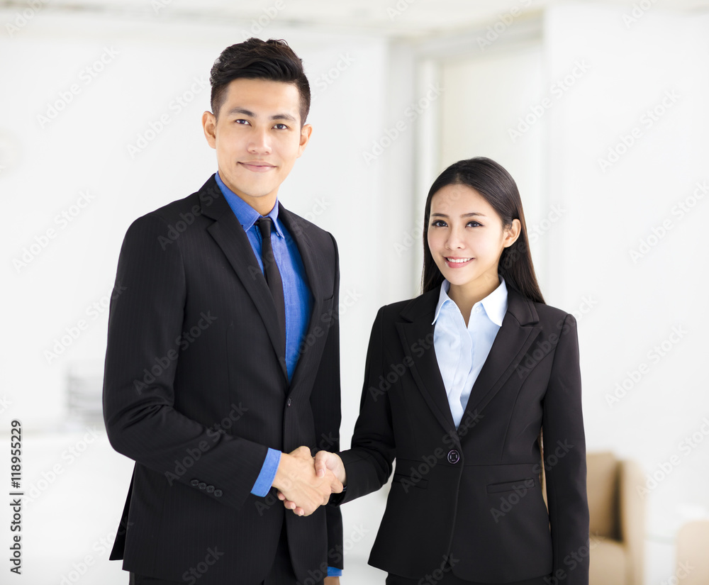 business woman and man handshaking in office business woman and man handshaking in office