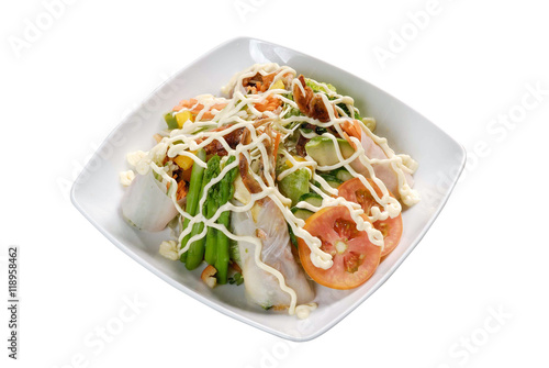 Mixed salad on white dish isolated on background.  