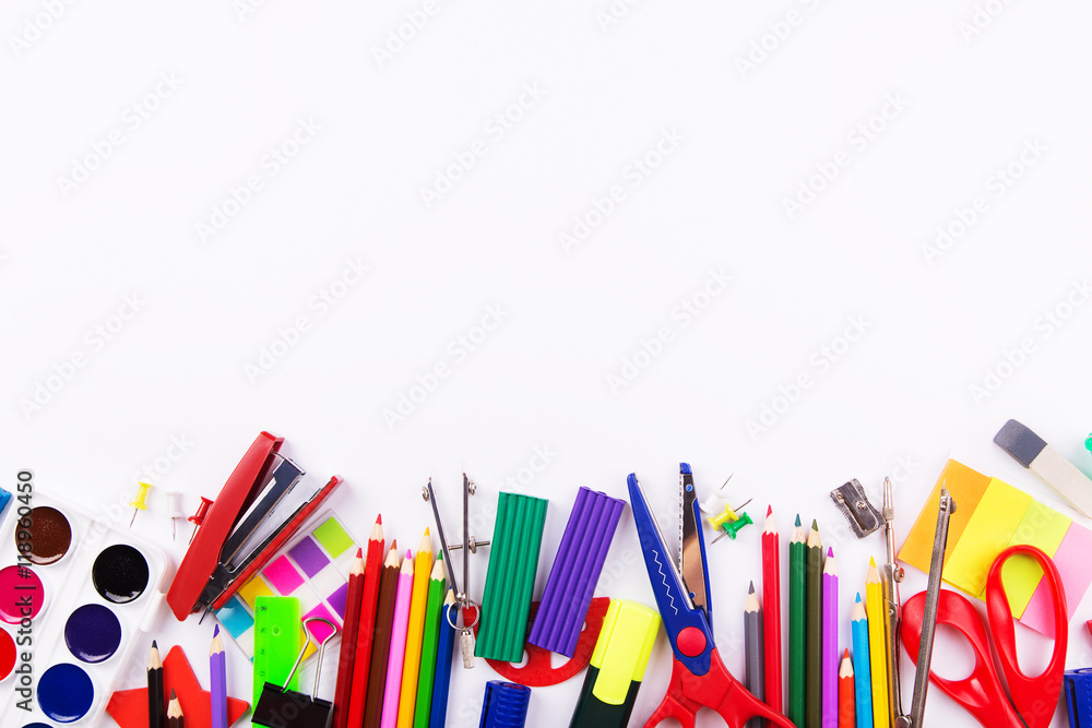 Various office supplies on a white background. Back to school.Top view with copyspace Various office supplies on a white background. Back to school.Top view with copyspace