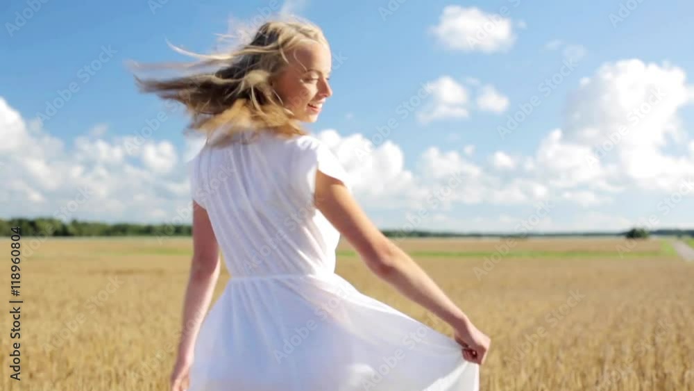 smiling young woman in white dress on cereal field smiling young woman in white dress on cereal field
