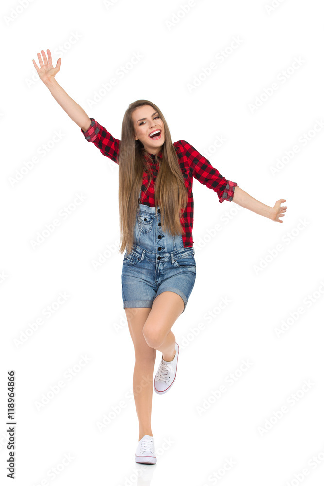 Carefree Girl Standing On One Leg With Arms Outstretched Carefree Girl Standing On One Leg With Arms Outstretched