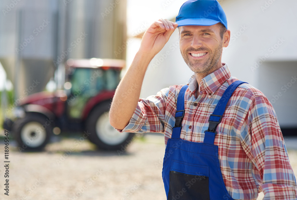 Fototapeta premium Happy farmer and his big farm