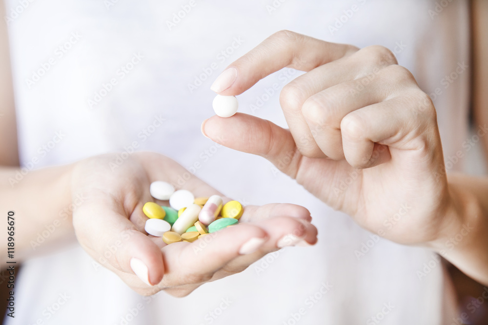 Pills in women's hands. a lot of different pills. Closeup. Pills in women's hands. a lot of different pills. Closeup.