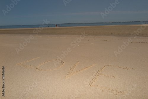 Word love on sand on the beach on holidays