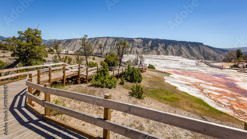 Wooden walkway in a beautiful landscape of Mammoth Hot Springs, Yellowstone National Park, Wyoming, USA