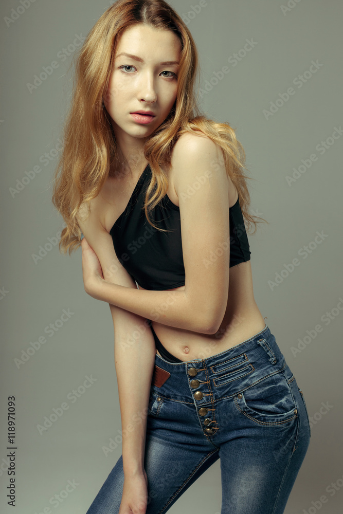 model tests of young pretty girl over grey background model tests of young pretty girl over grey background
