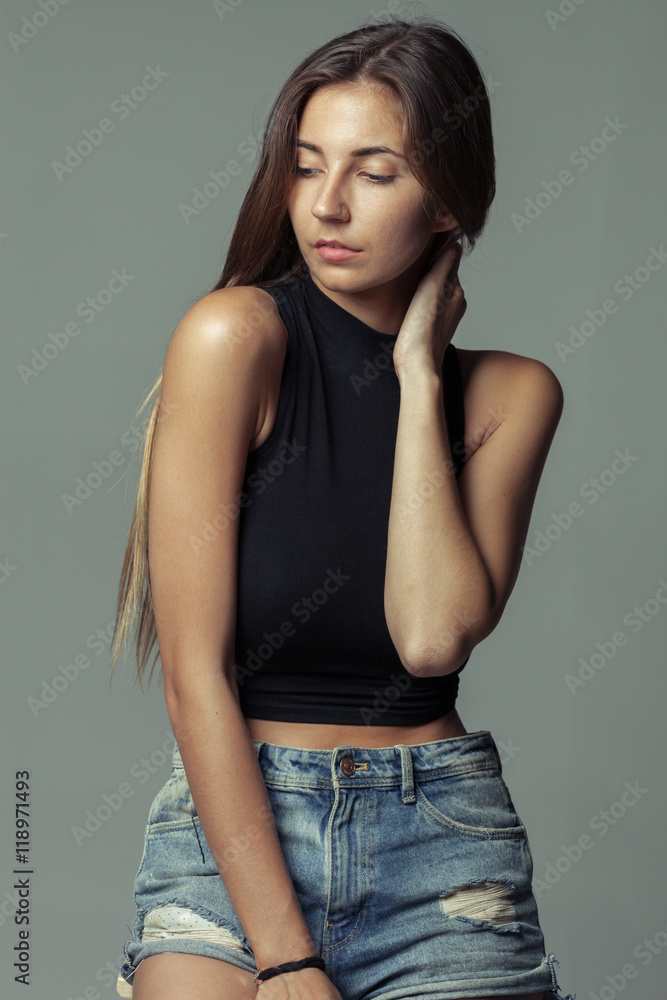 model tests of young pretty girl over grey background model tests of young pretty girl over grey background