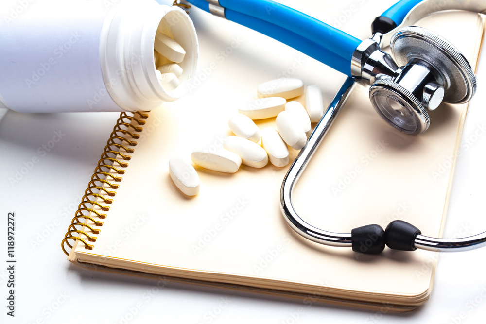 Empty prescription lying on table with stethoscope Empty prescription lying on table with stethoscope