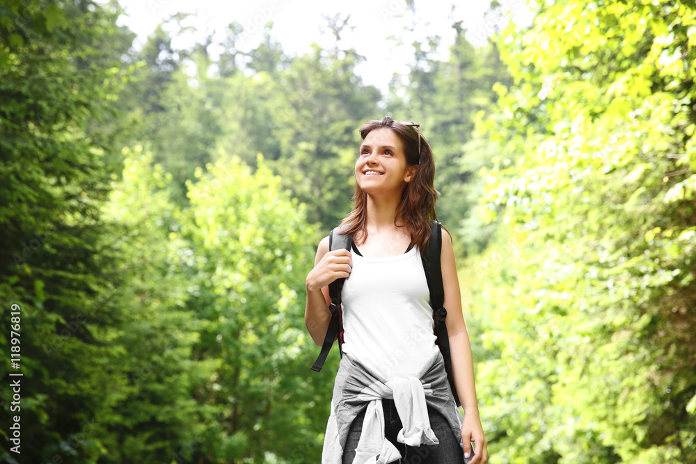 Happy traveler girl in forest Happy traveler girl in forest