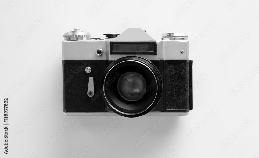 Vintage photo camera on white table