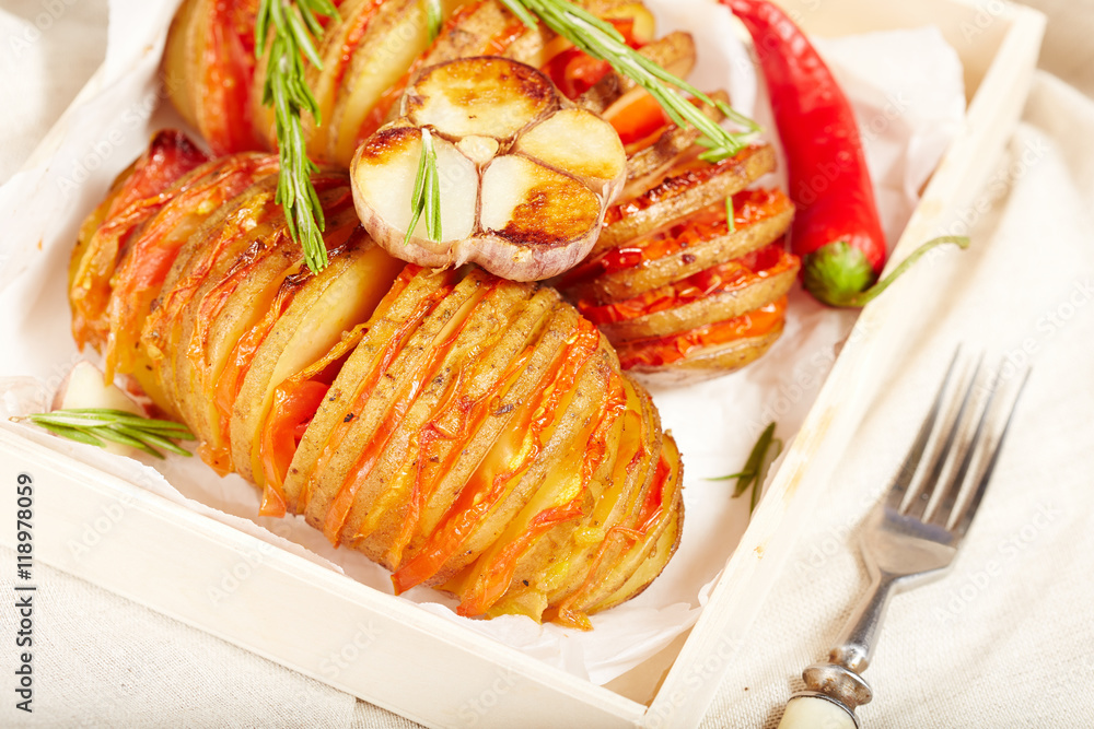 Potato roasted with tomatoes, served with rosemary, garlic and pepper, vegetarian dish