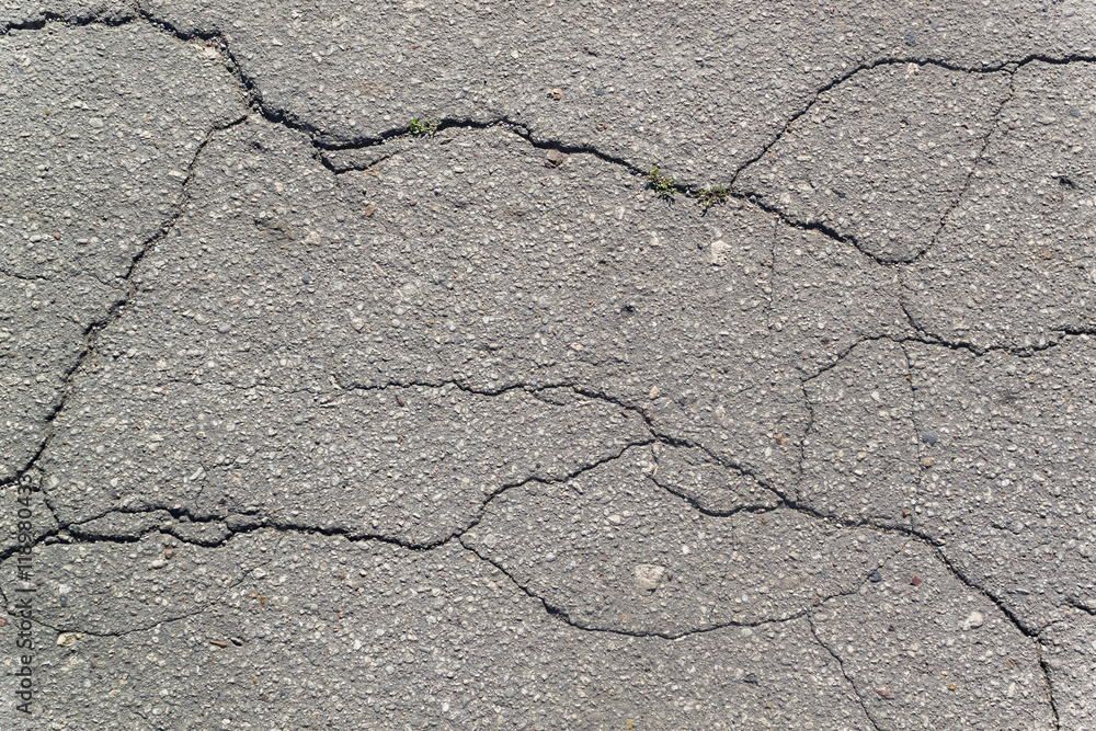 Obraz premium Texture of the old road with cracks