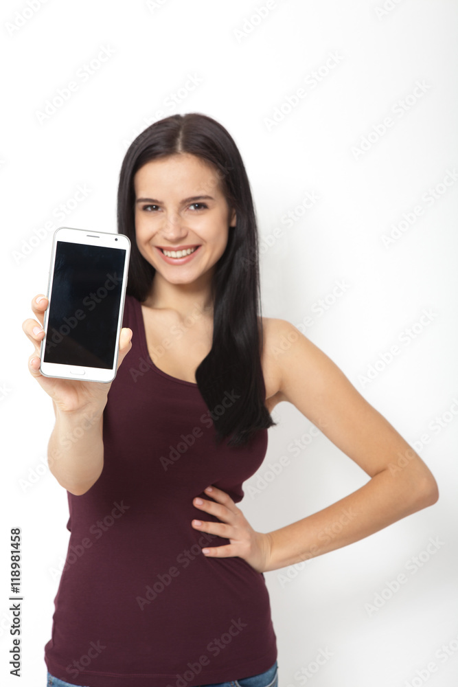 Woman hand holding the white smartphone. Woman hand holding the white smartphone.
