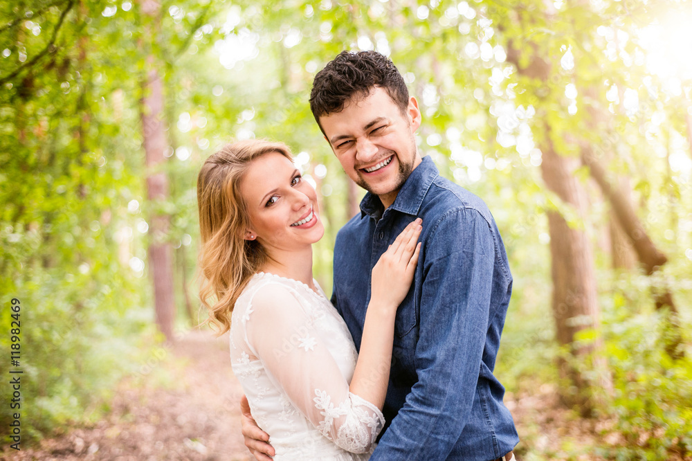 Beautiful wedding couple outside in green forest. Beautiful wedding couple outside in green forest.